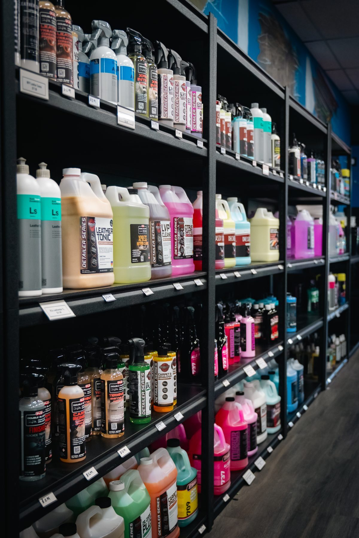 Colorful rows of detailing chemicals on shelves